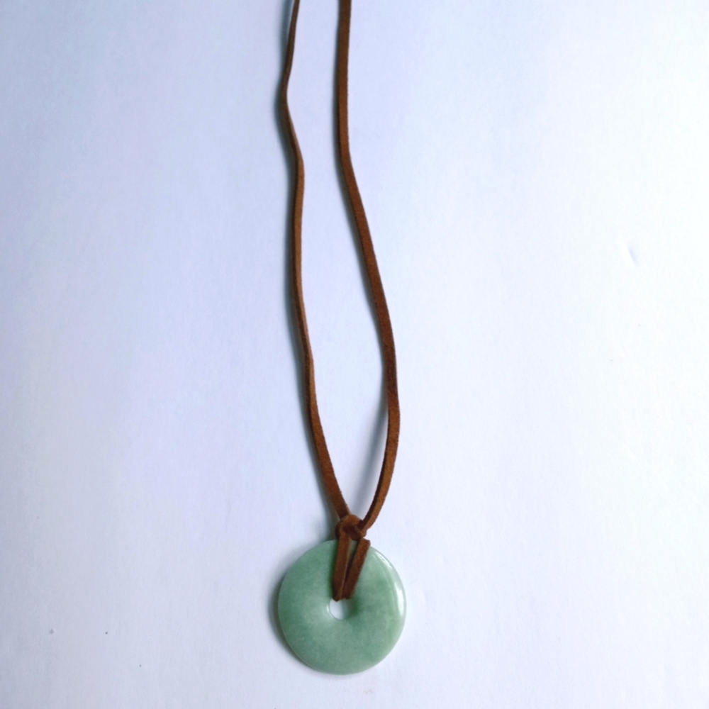 Handmade rare gemstone on brown leather cord